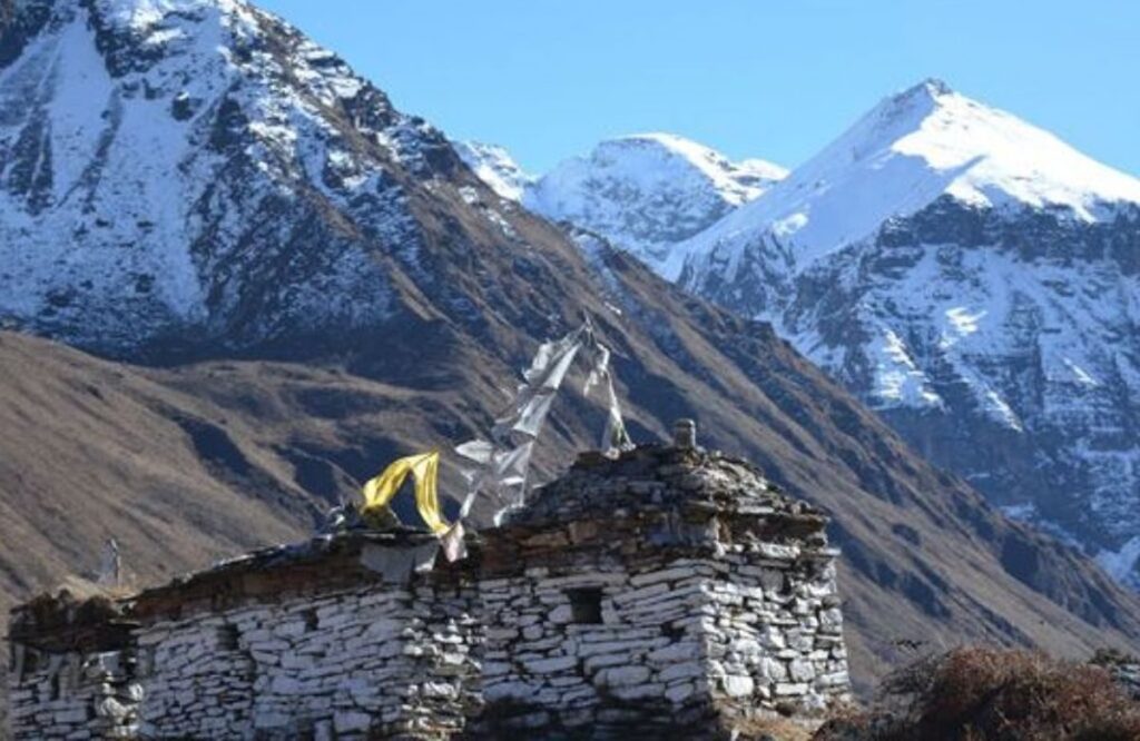 The ruined stone fort at Jangothang beneath snow peaks on the Jomolhari trek