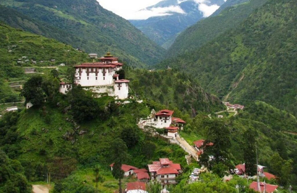 Lhuentse Dzong on its spur above a steep forested valley in eastern Bhutan