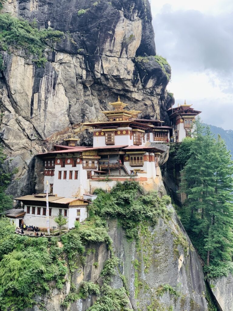 The whitewashed buildings and golden roofs of the Tiger's Nest seen close from the approach